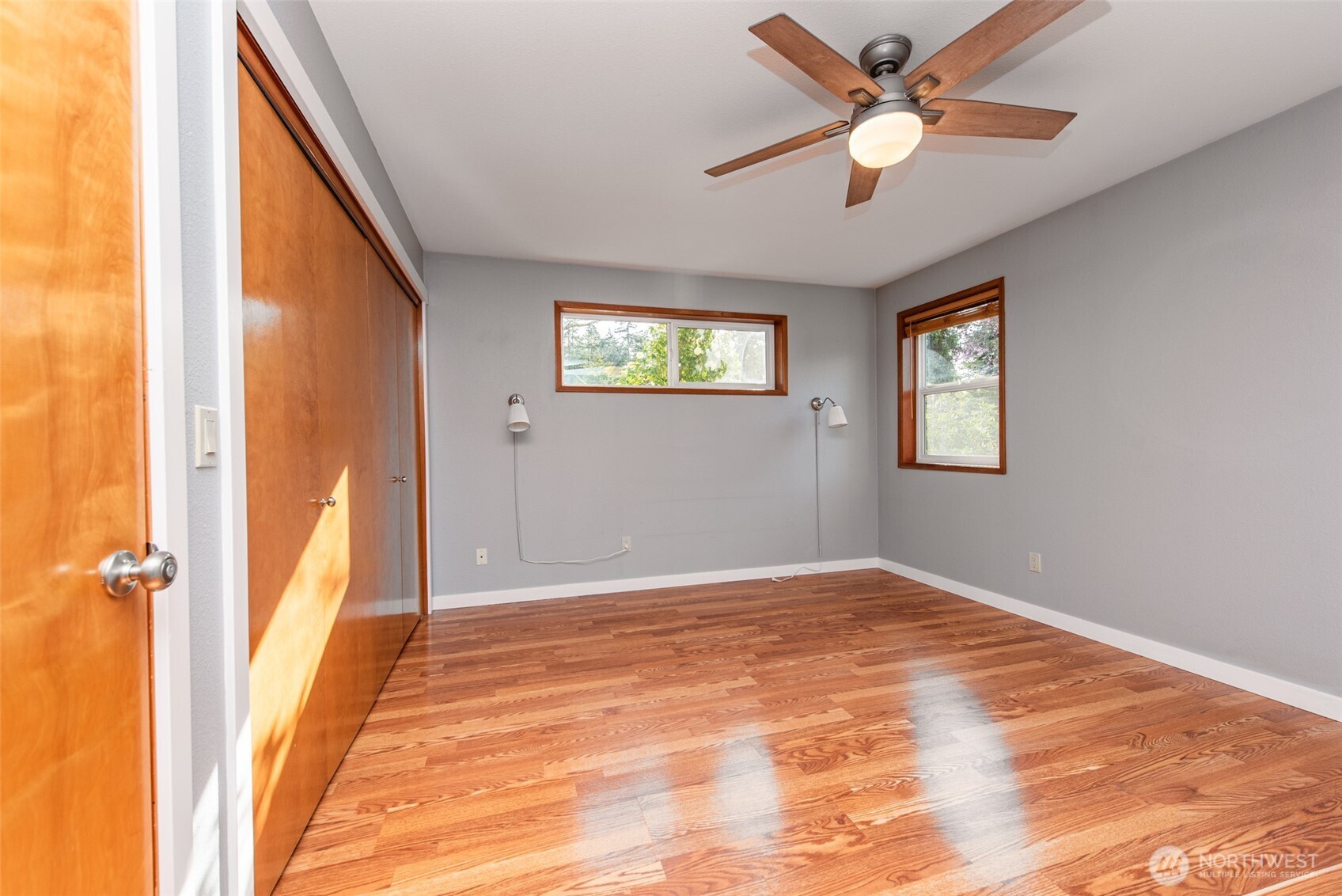 151 Nicole Place Sequim, WA 98382 - Photo 29 of 40 a view of a big room with wooden floor and windows