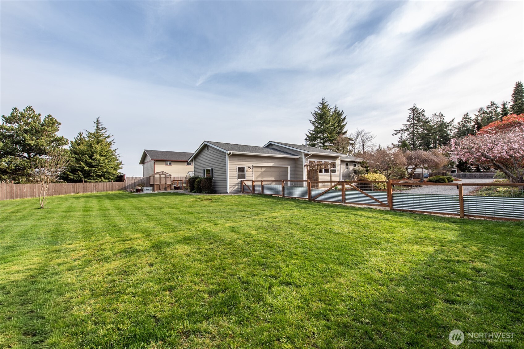 151 Nicole Place Sequim, WA 98382 - Photo 34 of 40 a view of a house with a yard