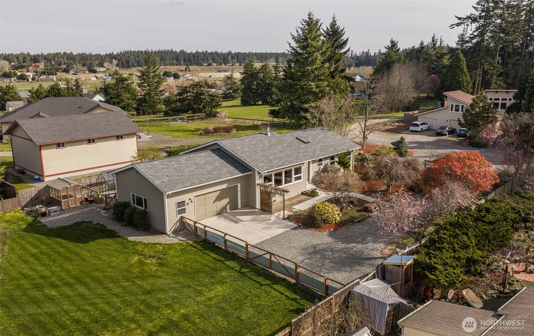 151 Nicole Place Sequim, WA 98382 - Photo 38 of 40 an aerial view of a house with a garden and lake view