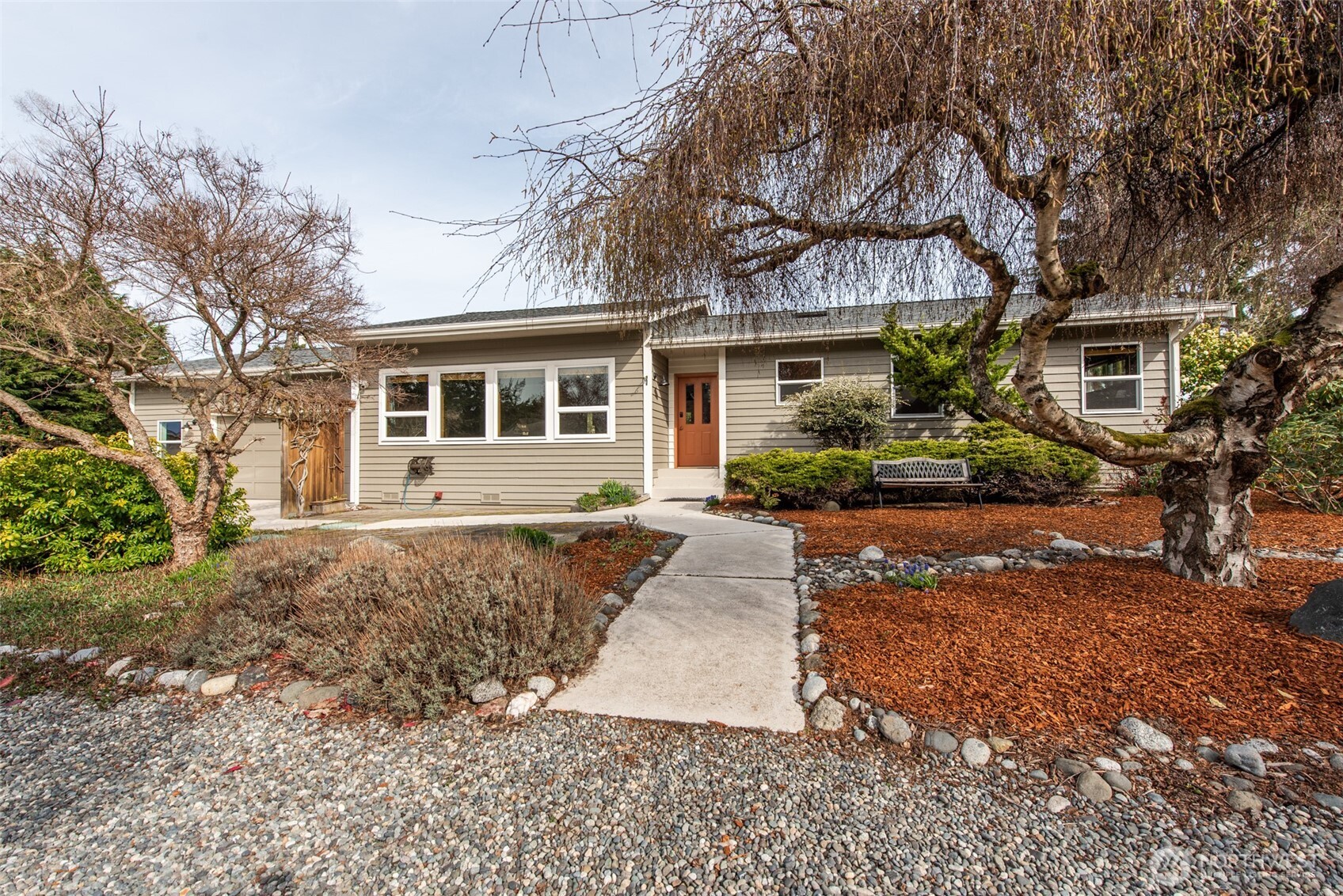 151 Nicole Place Sequim, WA 98382 - Photo 5 of 40 a front view of a house with a yard and potted plants