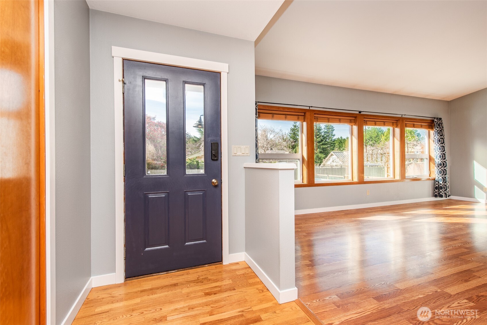 151 Nicole Place Sequim, WA 98382 - Photo 6 of 40 a view of a bedroom with wooden floor and front door
