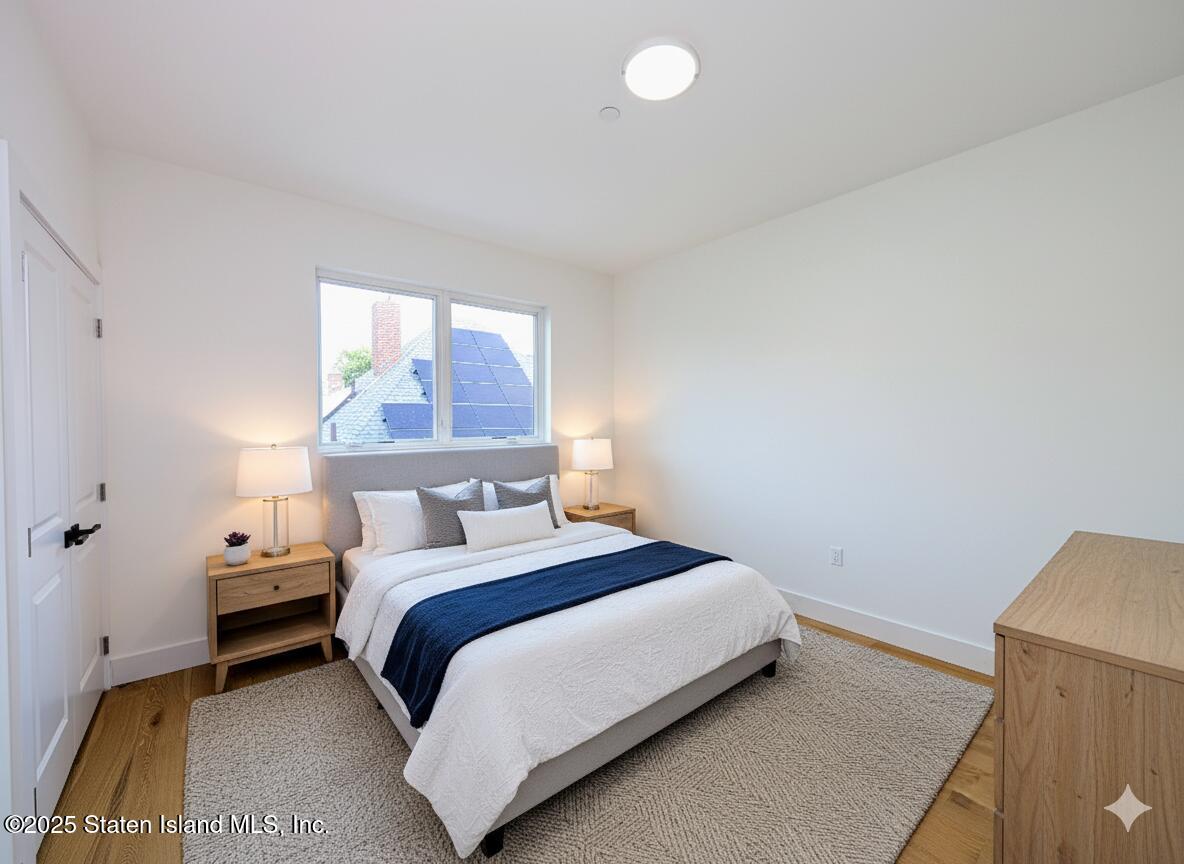 3865 Amboy Road, Unit 4B Staten Island, NY 10308 - Photo 10 of 20 a bedroom with a bed and window
