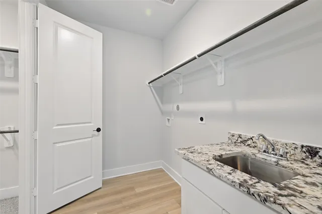 a kitchen with a cabinets and a sink