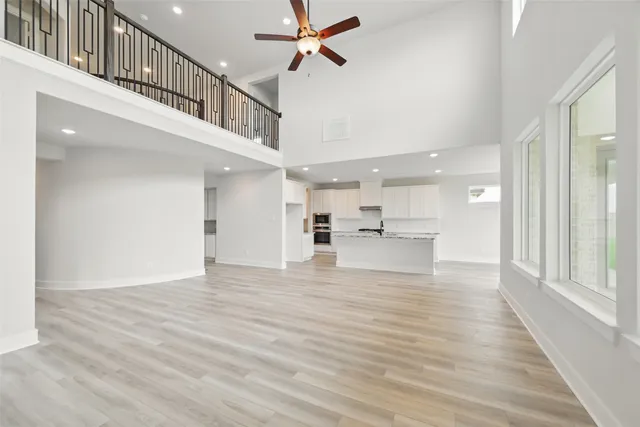 a view of an entryway and kitchen in a room