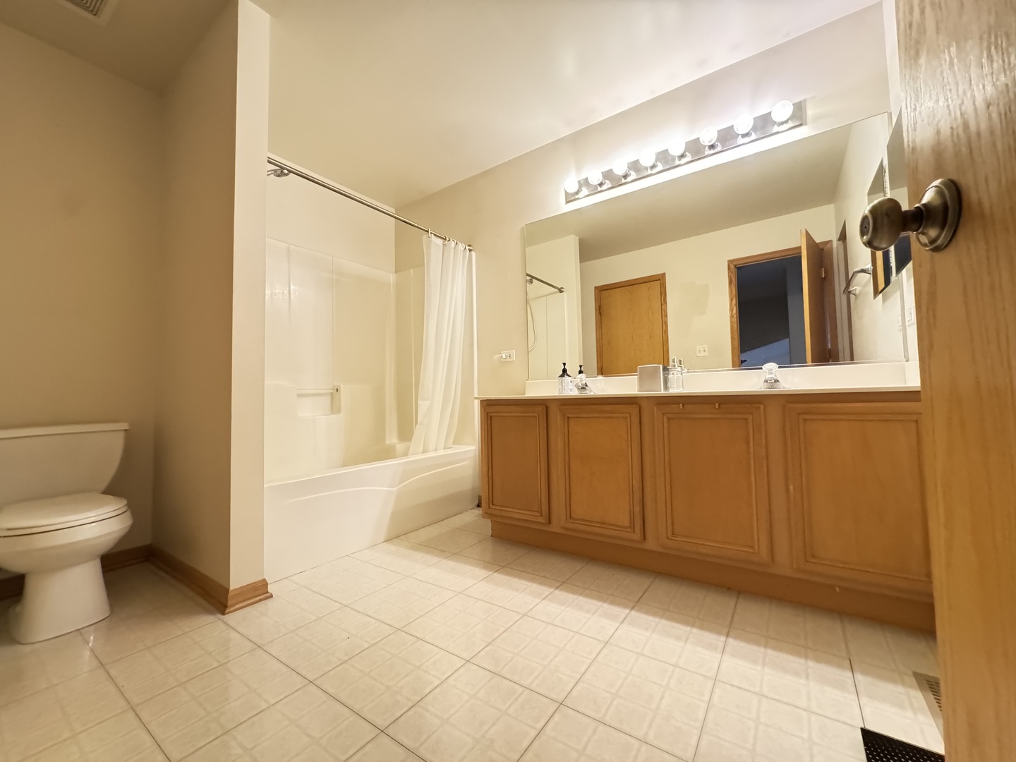 1606 Donegal Drive Minooka, IL 60447 - Photo 13 of 17 a bathroom with a granite countertop sink mirror vanity and toilet