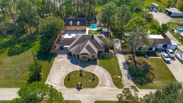 an aerial view of a house with outdoor space swimming pool and mountains