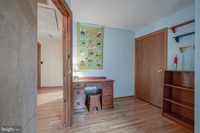 a living room with furniture a rug and a window