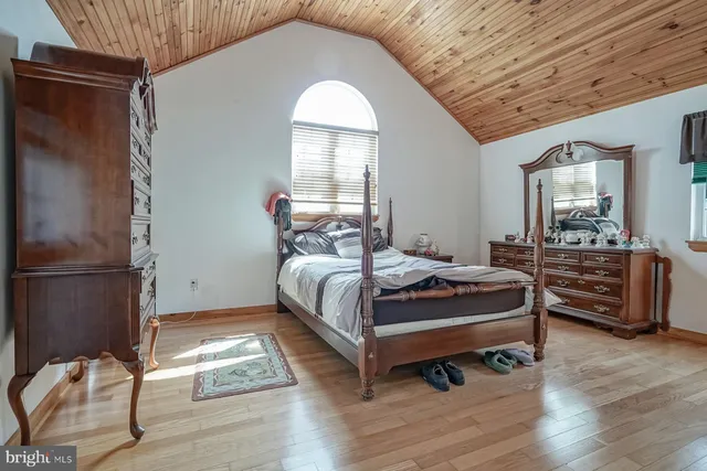 a front view of a house with yard and green space