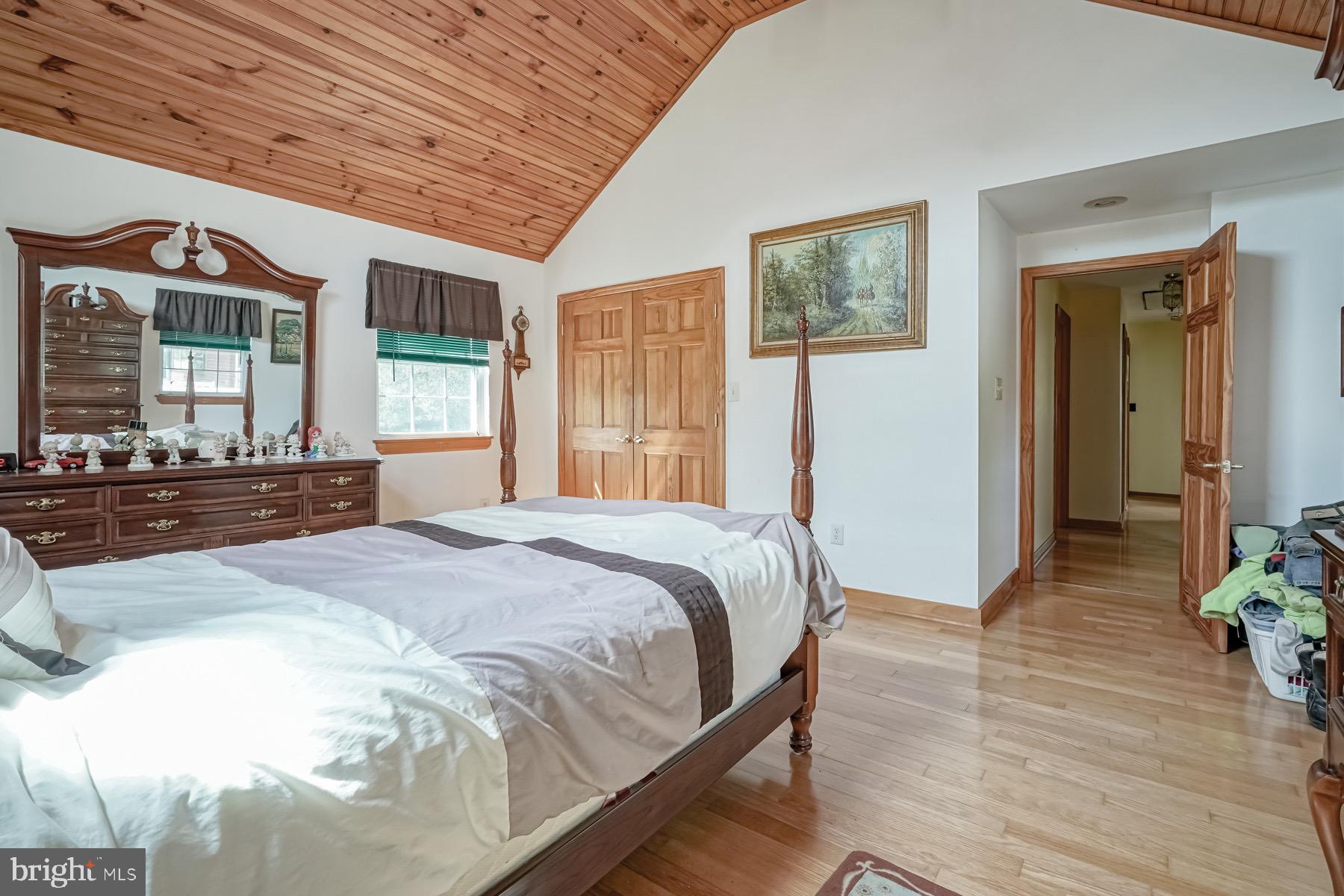 329 Lakedale Road Berlin, NJ 08009 - Photo 14 of 63 a spacious bedroom with a bed and a large window