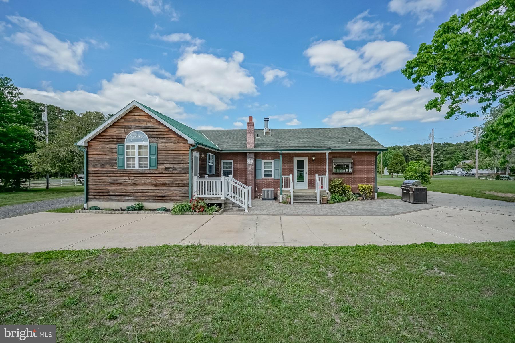 329 Lakedale Road Berlin, NJ 08009 - Photo 16 of 63 a front view of a house with yard and green space