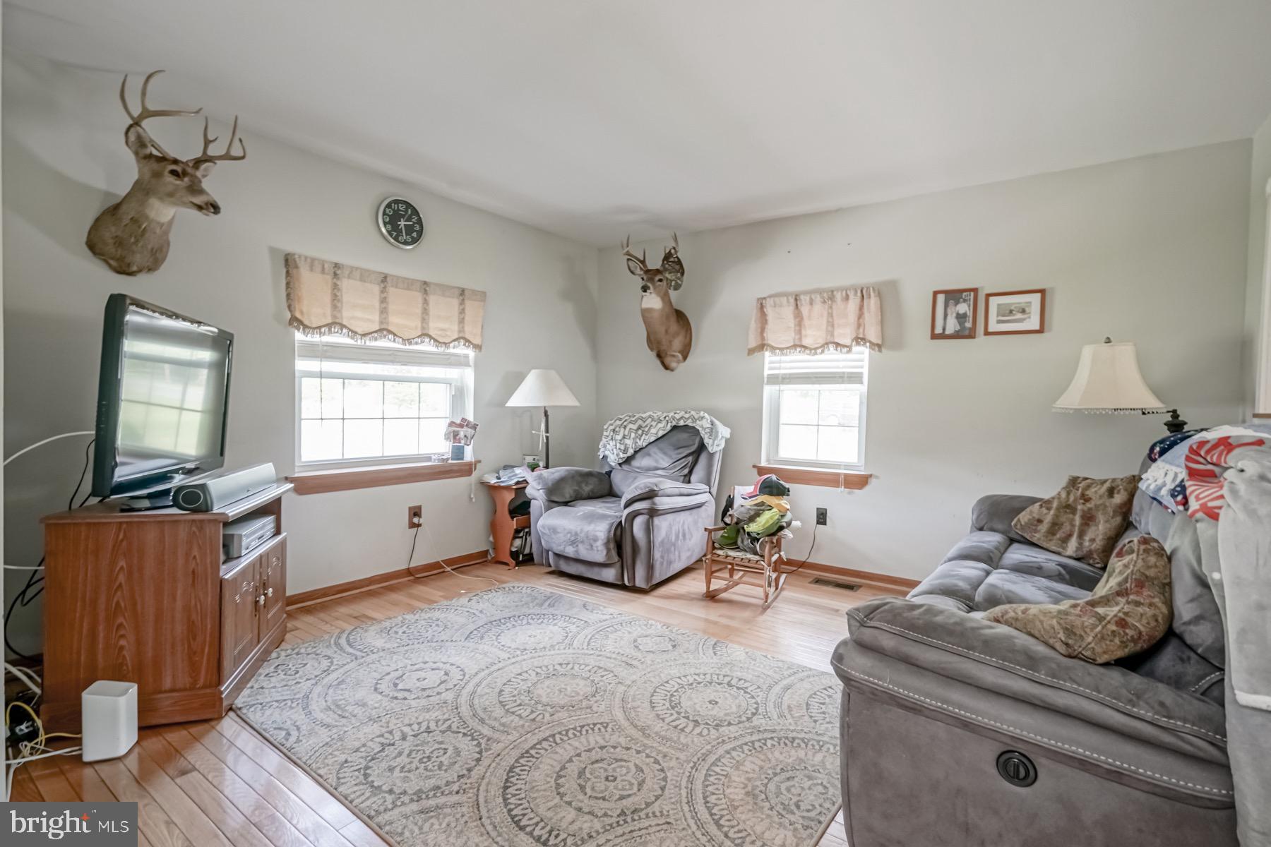 329 Lakedale Road Berlin, NJ 08009 - Photo 22 of 63 a living room with furniture and a flat screen tv