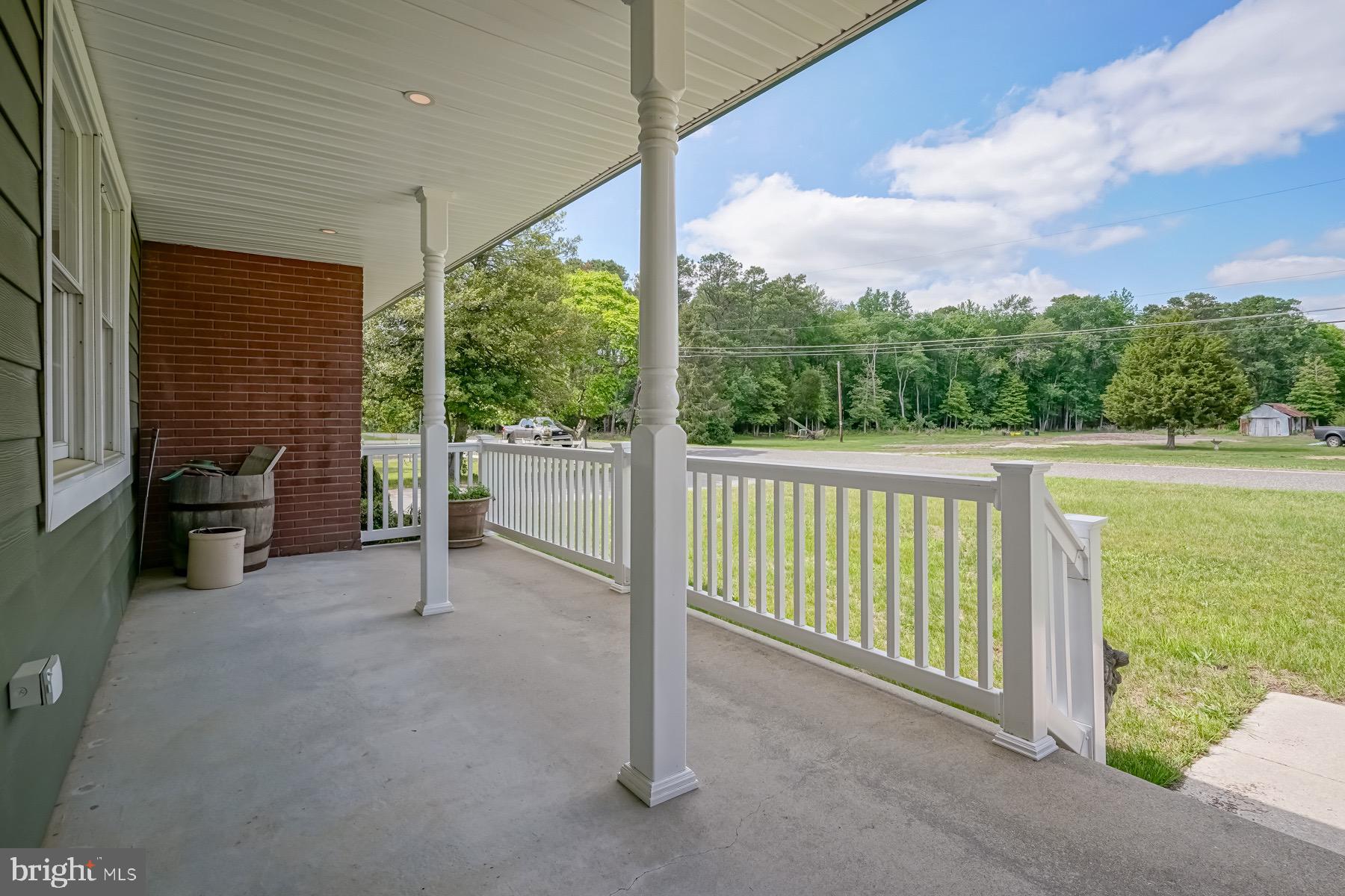 329 Lakedale Road Berlin, NJ 08009 - Photo 26 of 63 a view of a porch with furniture and a yard