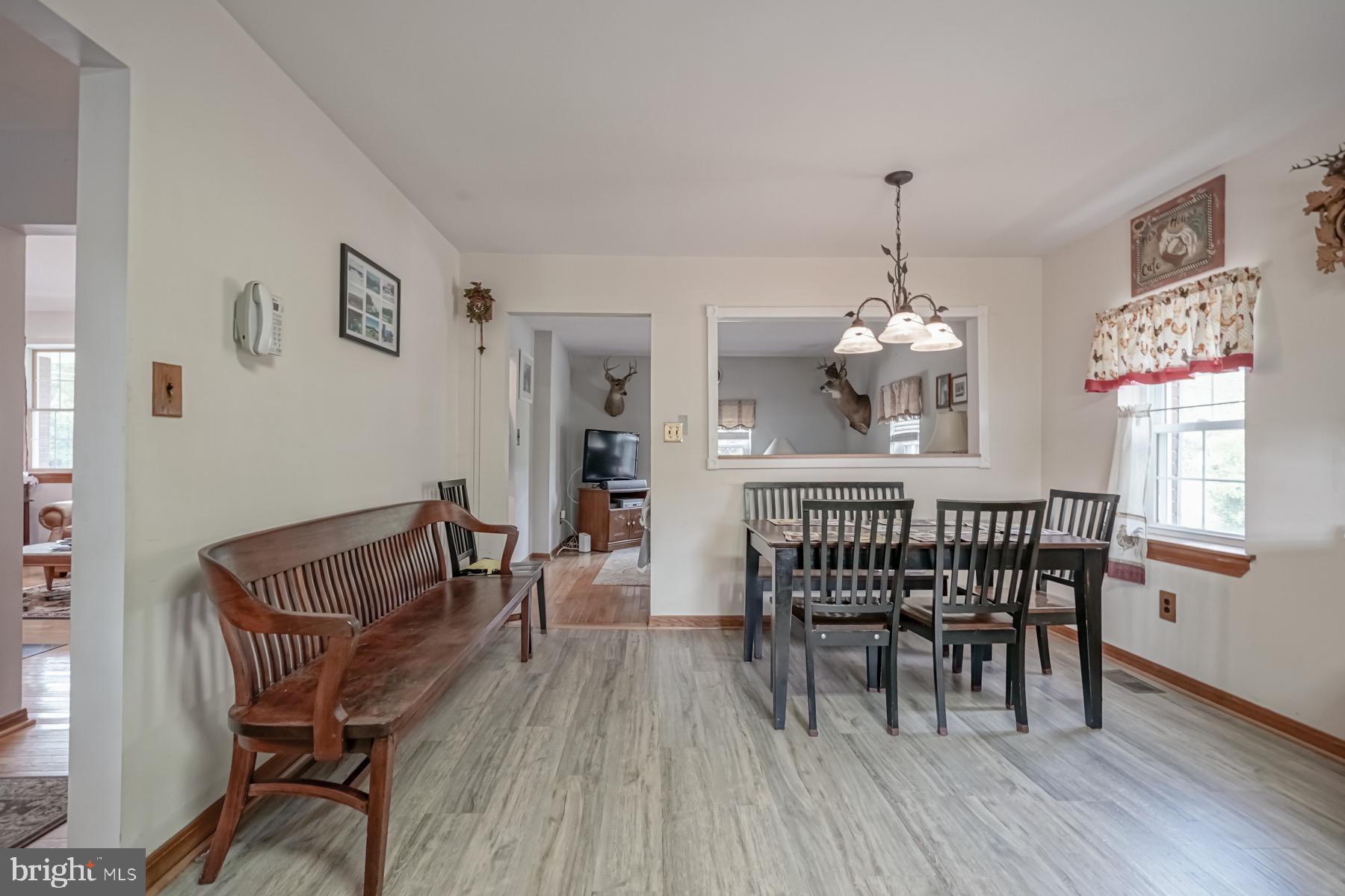 329 Lakedale Road Berlin, NJ 08009 - Photo 33 of 63 a view of a dining room with furniture window and wooden floor