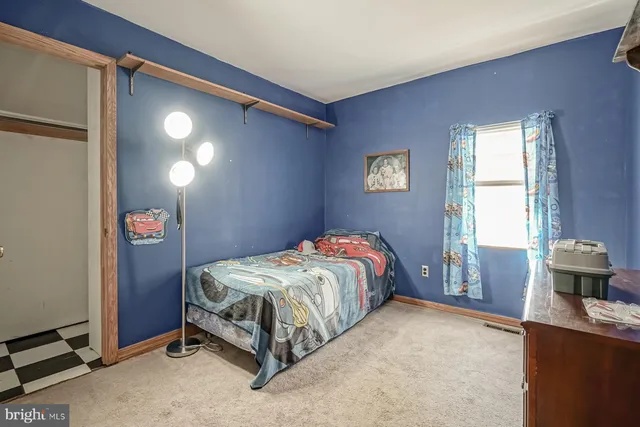a aerial view of a house with a yard table and chairs