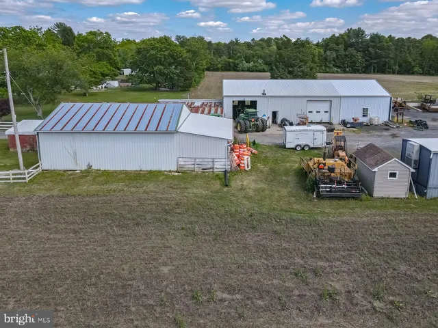 a aerial view of a house with a yard