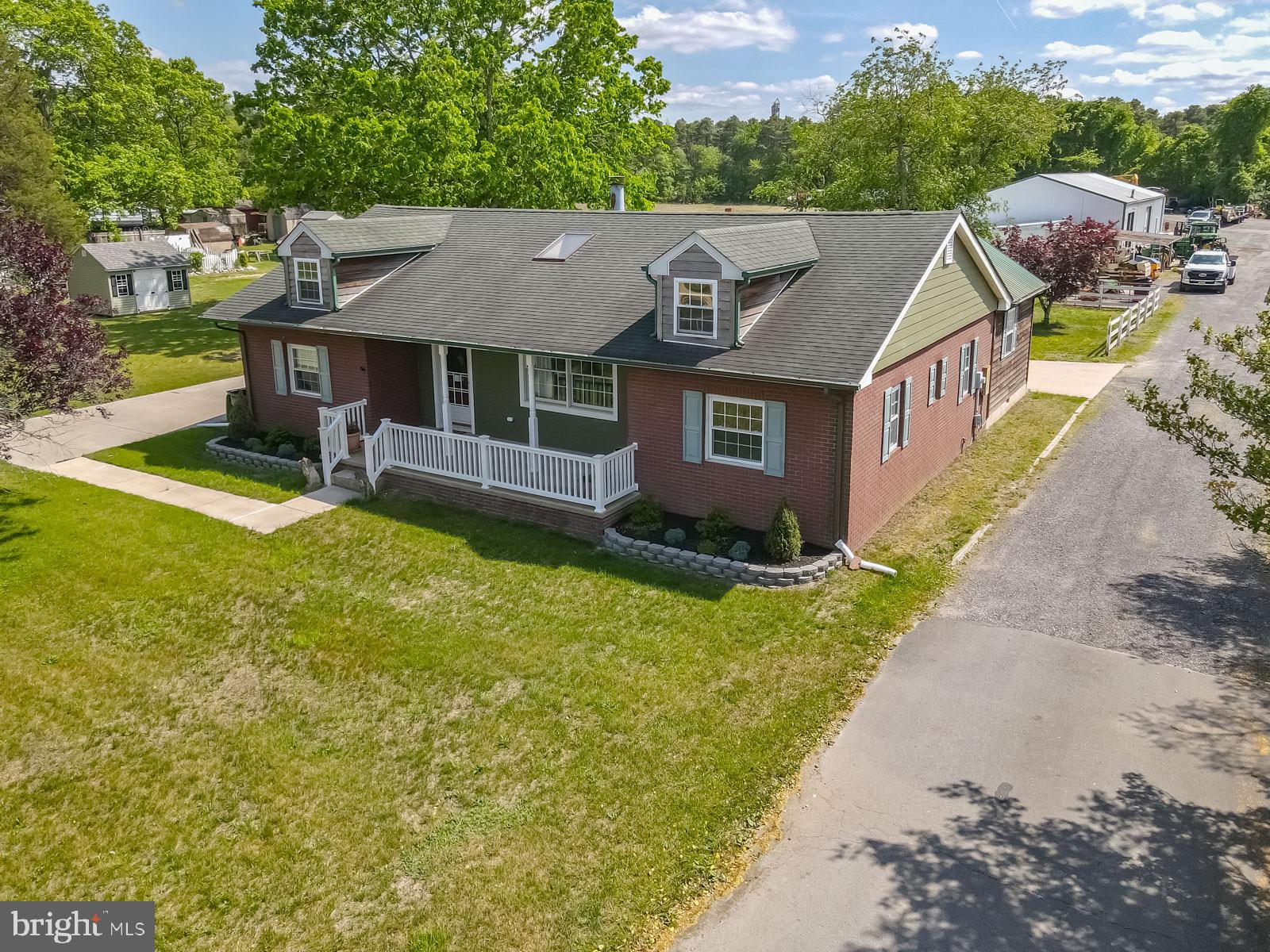 329 Lakedale Road Berlin, NJ 08009 - Photo 46 of 63 a aerial view of a house with a yard table and chairs