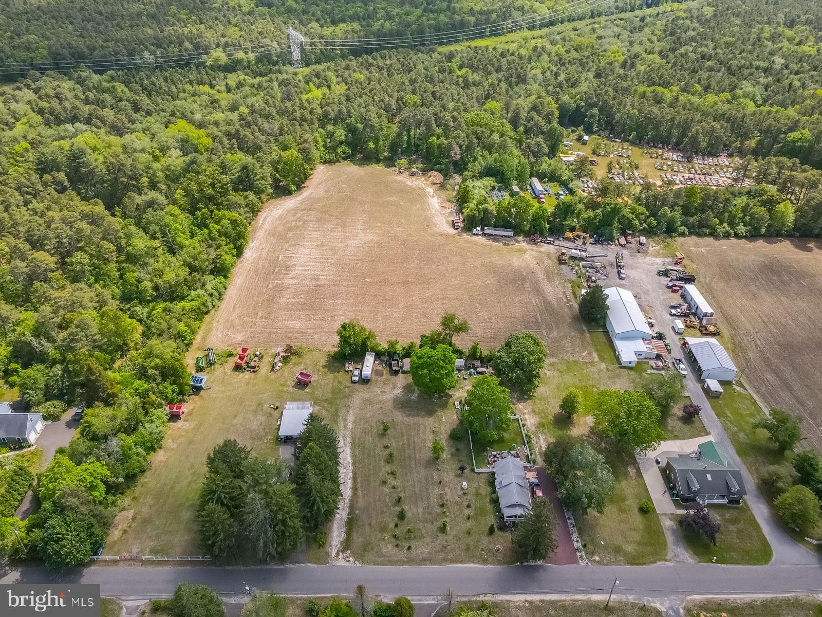 329 Lakedale Road Berlin, NJ 08009 - Photo 6 of 63 an aerial view of a house with a yard and trees