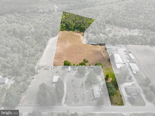 a bedroom with a bed and a mirror