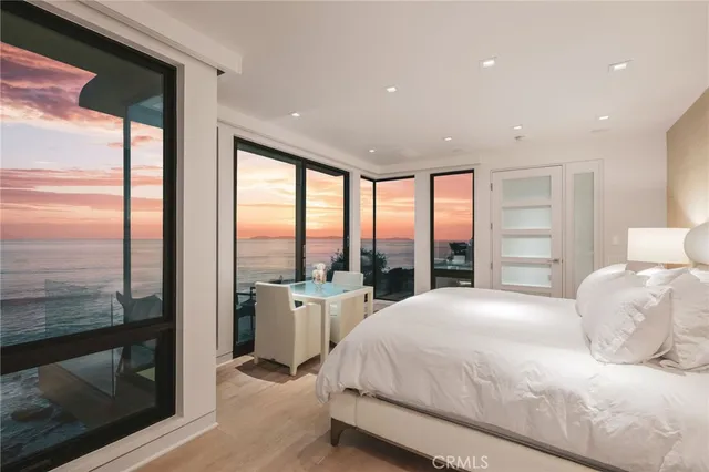 a view of a white house with a street