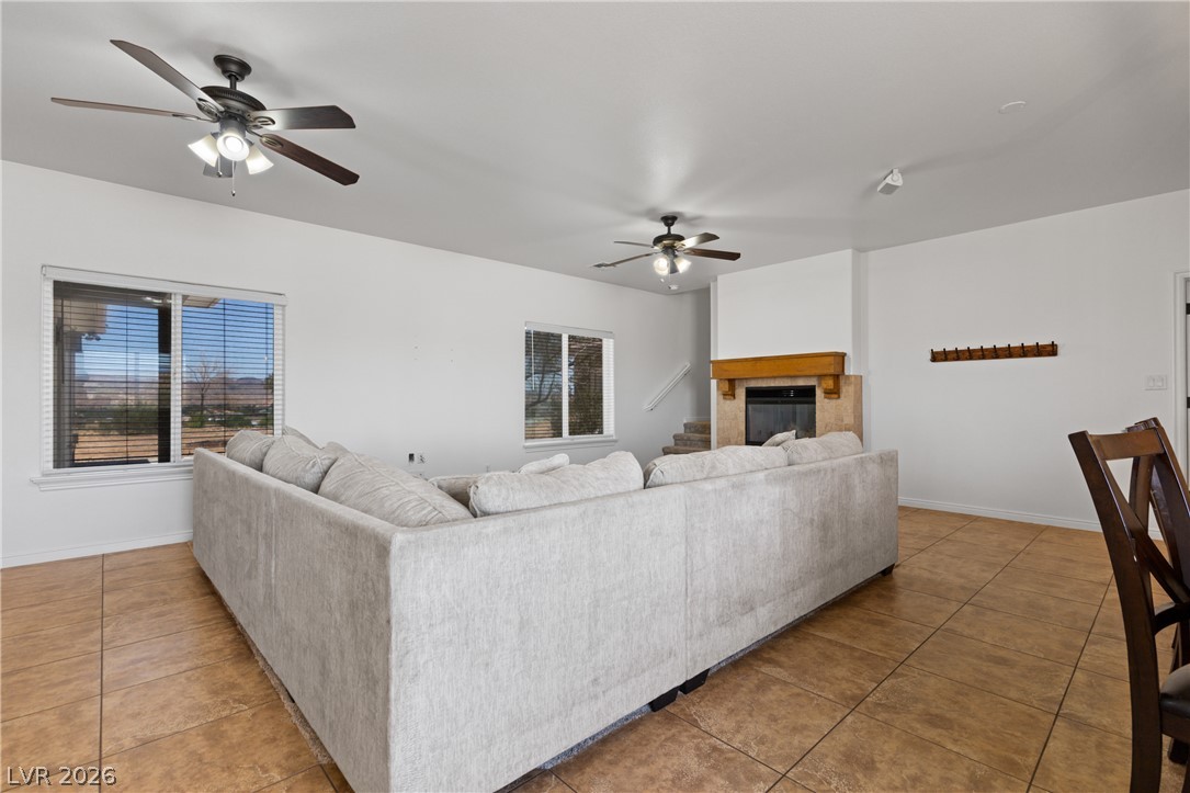 575 Gann Avenue Logandale, NV 89021 - Photo 11 of 75 The living room offers bright, naturally illuminated spaces with a warm fireplace for comfortable gatherings.