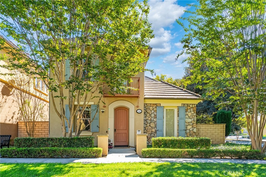 a front view of a house with garden