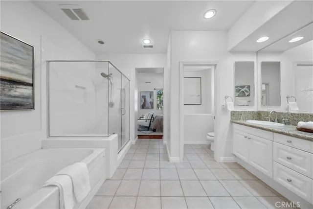 a bathroom with a tub shower and sink