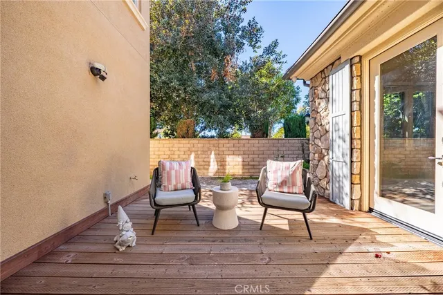 a view of two chairs in the balcony