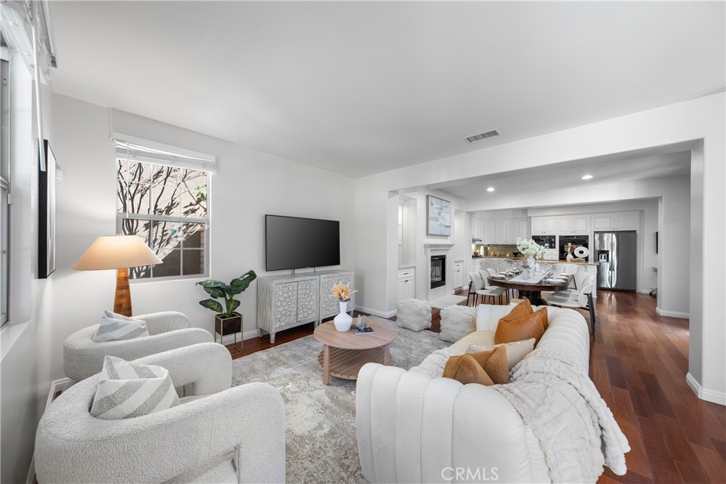 26 Twin Gables Irvine, CA 92620 - Photo 4 of 36 a living room with furniture and a flat screen tv