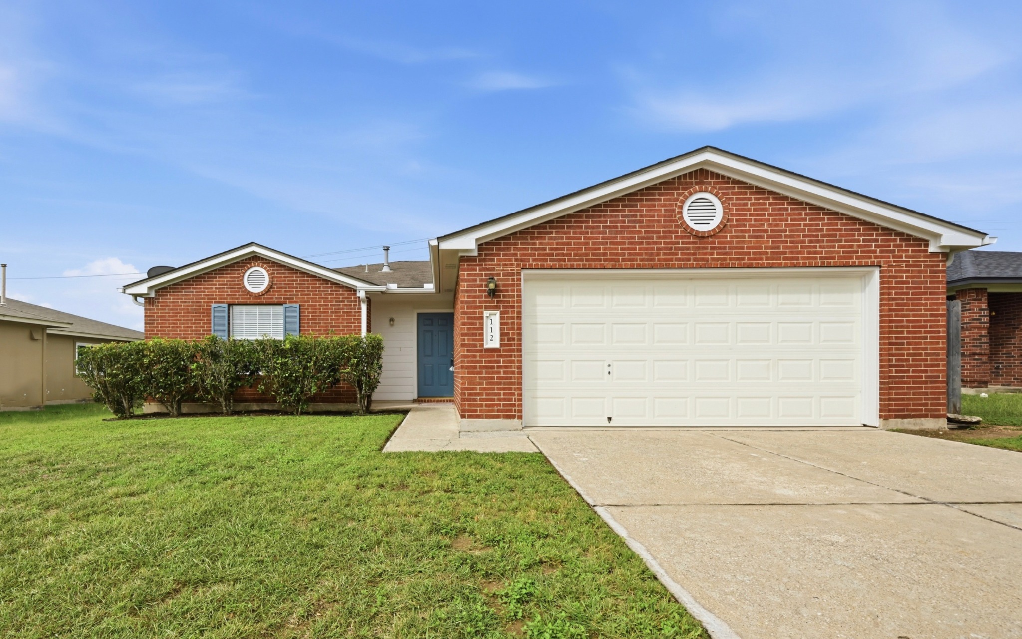 112 Mason Reed Cove Kyle, TX 78640 - Photo 2 of 26 a front view of a house with garden
