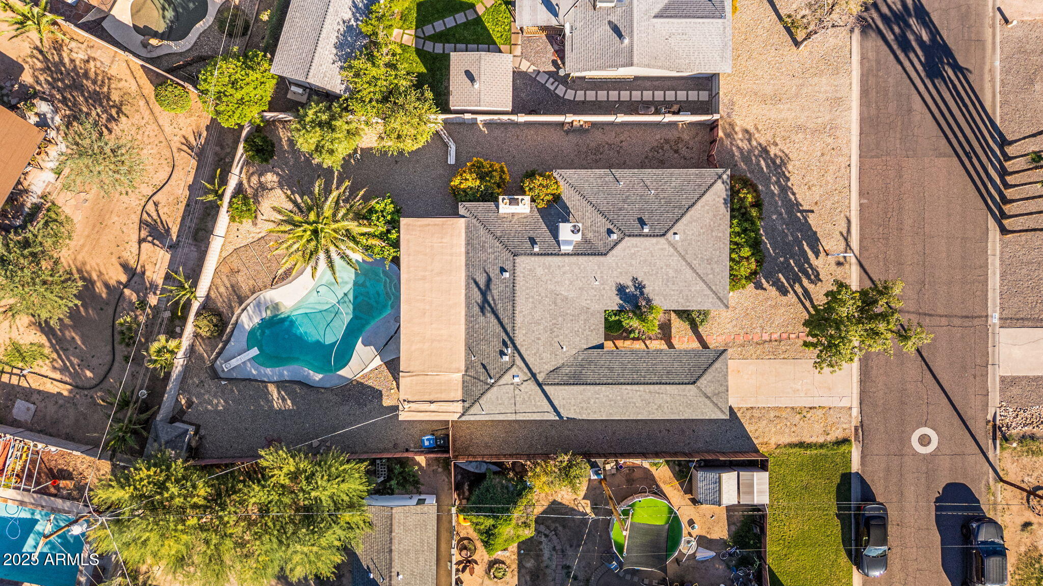 an aerial view of residential houses with outdoor space