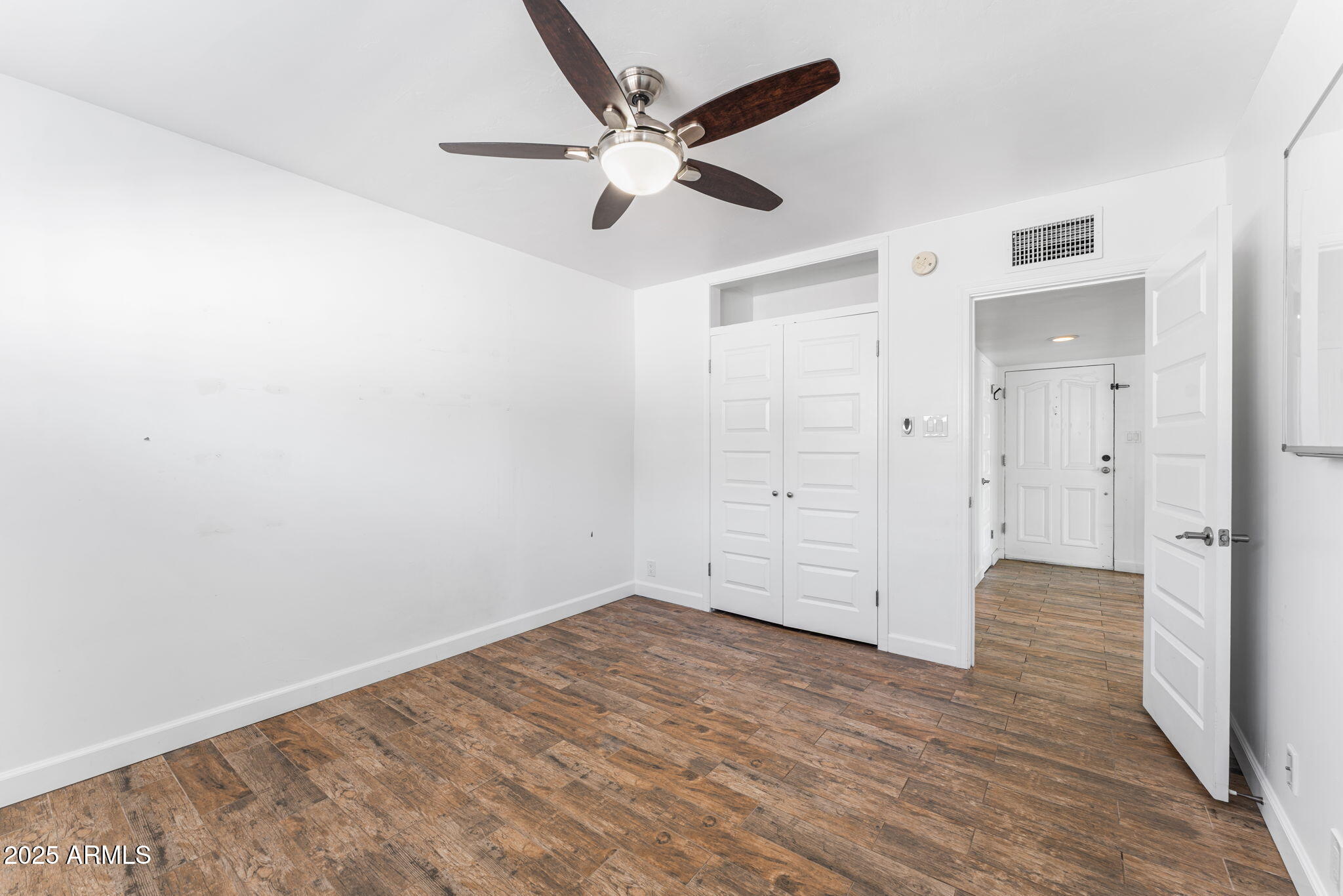 1334 West Sells Drive Phoenix, AZ 85013 - Photo 13 of 32 wooden floor in an empty room