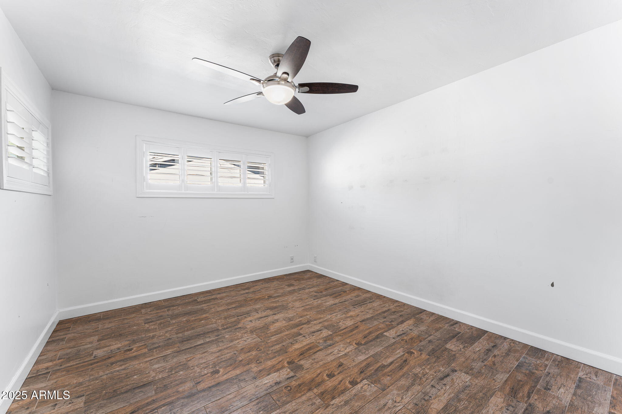 1334 West Sells Drive Phoenix, AZ 85013 - Photo 14 of 32 wooden floor in an empty room