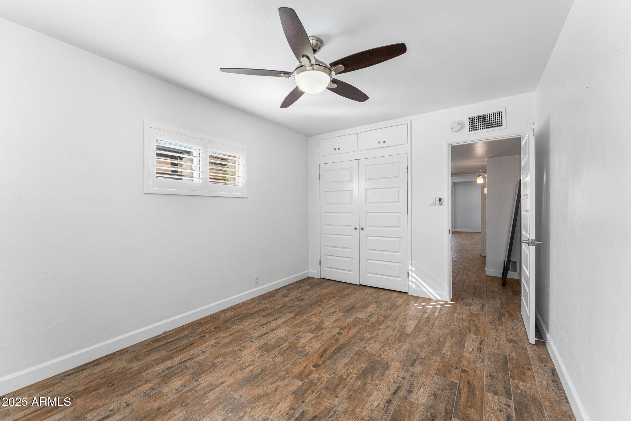 1334 West Sells Drive Phoenix, AZ 85013 - Photo 16 of 32 wooden floor in an empty room