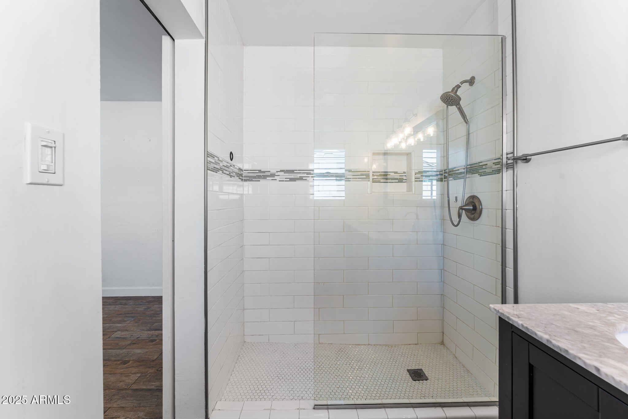 1334 West Sells Drive Phoenix, AZ 85013 - Photo 19 of 32 a bathroom with a glass shower door