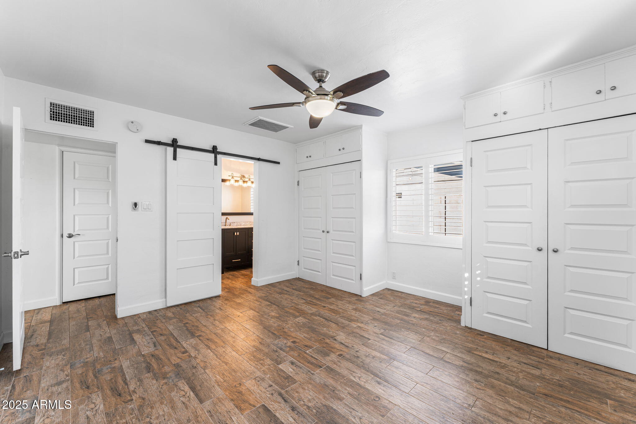 1334 West Sells Drive Phoenix, AZ 85013 - Photo 21 of 32 wooden floor in an empty room