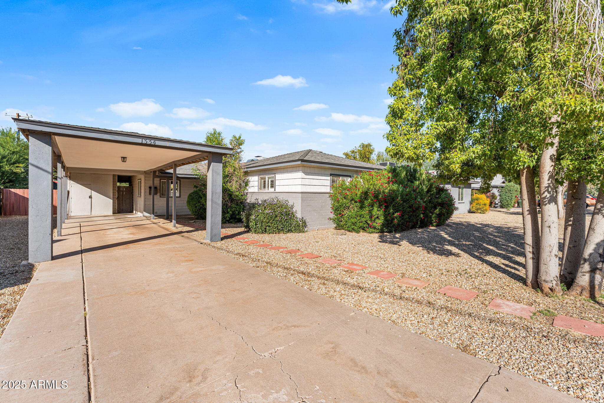 1334 West Sells Drive Phoenix, AZ 85013 - Photo 3 of 32 a front view of a house with a yard and potted plants