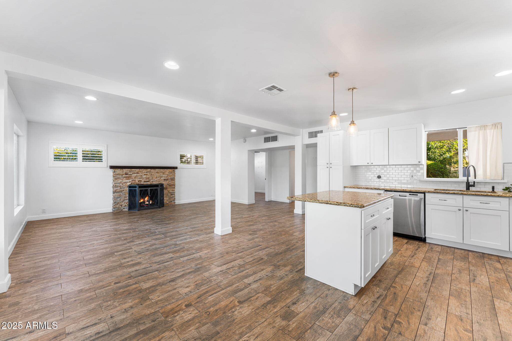 1334 West Sells Drive Phoenix, AZ 85013 - Photo 6 of 32 a large kitchen with a lot of counter space and wooden floor