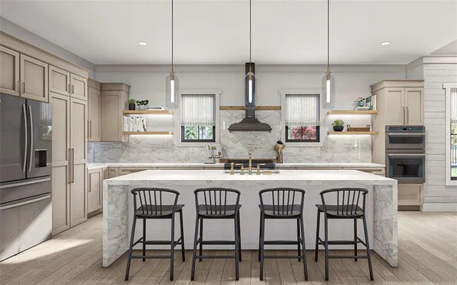 a kitchen with stainless steel appliances granite countertop a sink a stove a refrigerator and island with wooden floor