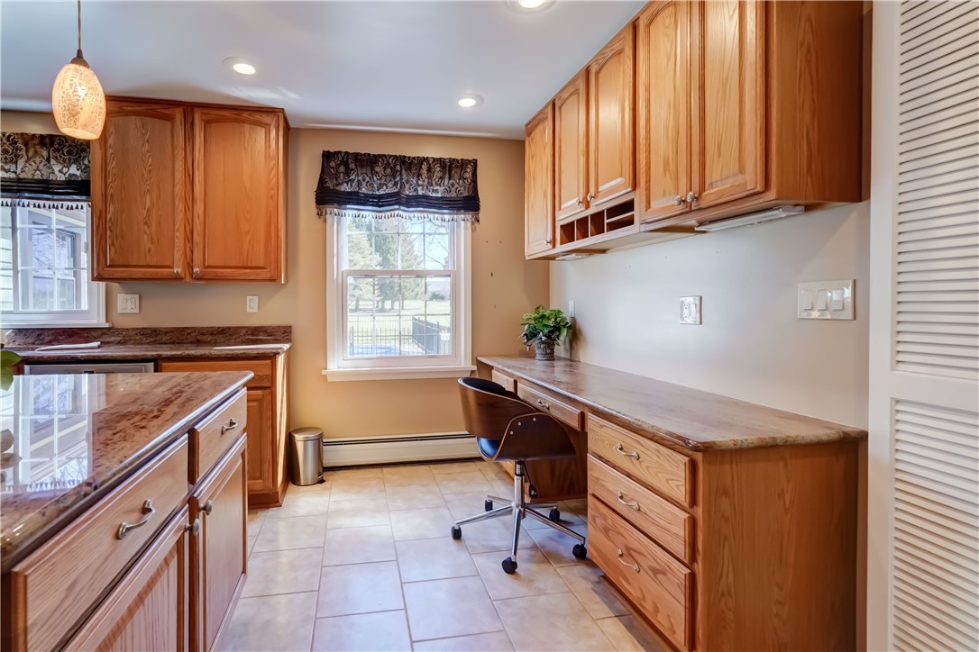 1776 Jackson Road Penfield, NY 14526 - Photo 20 of 50 Thoughtful message/work station with cabinetry abo