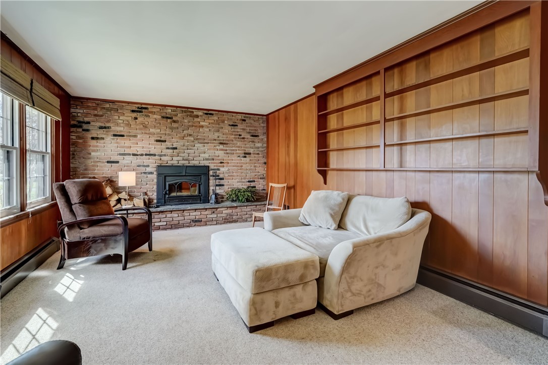 1776 Jackson Road Penfield, NY 14526 - Photo 23 of 50 Built-in bookshelves to the right and a fully bric