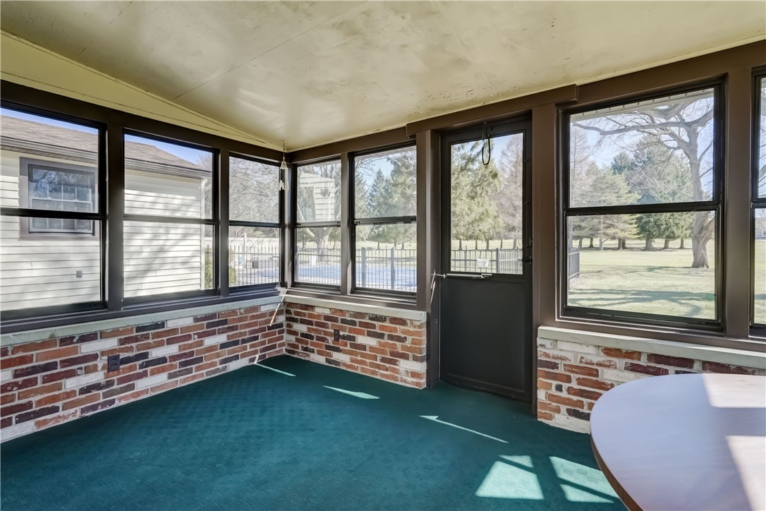 1776 Jackson Road Penfield, NY 14526 - Photo 27 of 50 Alternate view of the enclosed porch with views to