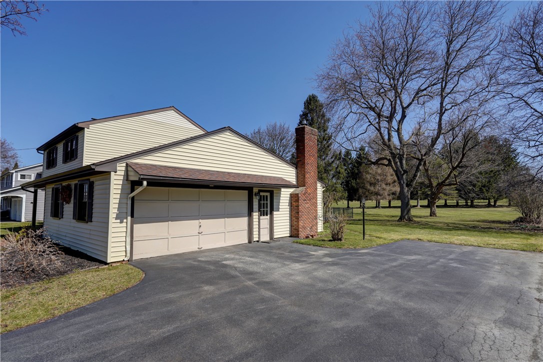 1776 Jackson Road Penfield, NY 14526 - Photo 3 of 50 2-car side load garage with "people" door offering