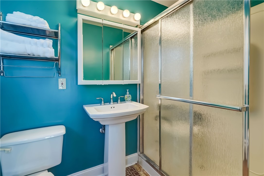 1776 Jackson Road Penfield, NY 14526 - Photo 37 of 50 Primary bath with pedestal sink, tile flooring and