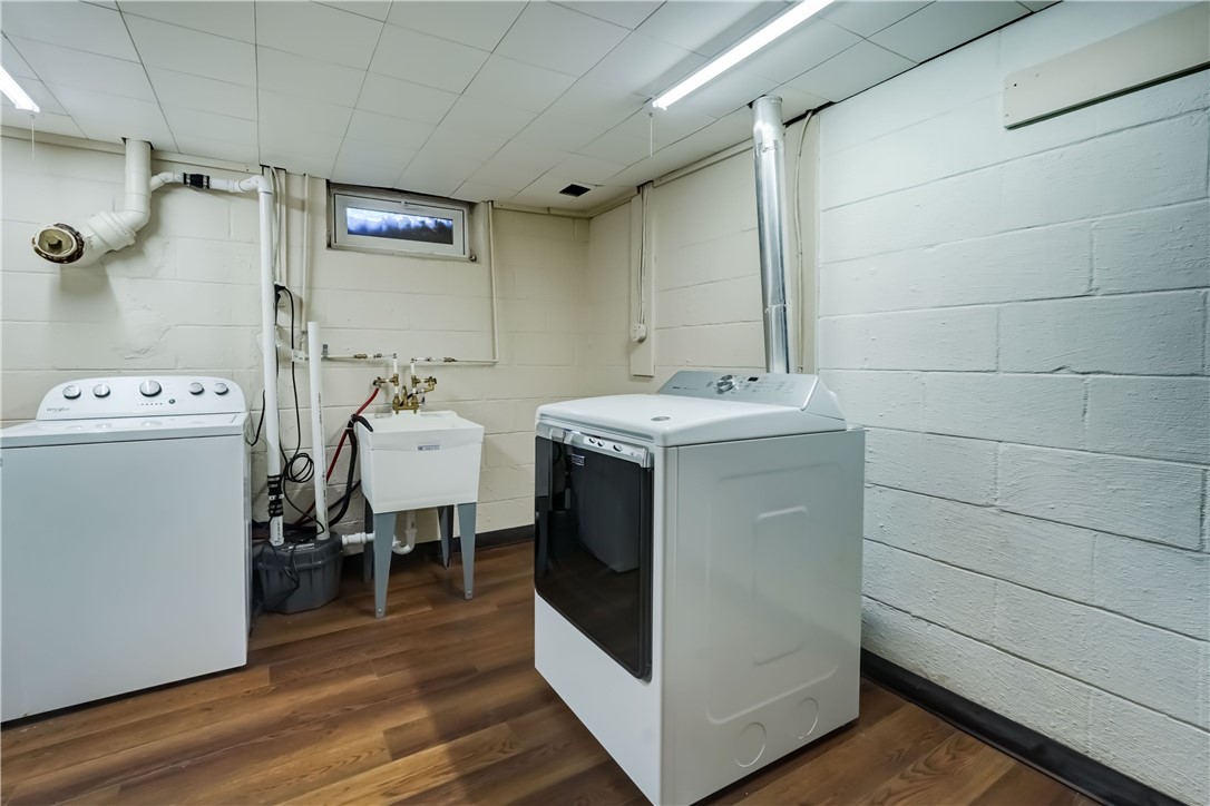 1776 Jackson Road Penfield, NY 14526 - Photo 41 of 50 Well lit laundry with resilient flooring, sink, wa
