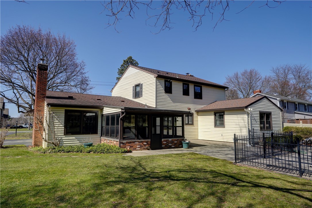 1776 Jackson Road Penfield, NY 14526 - Photo 42 of 50 Rear elevation looking towards the 3-season enclos