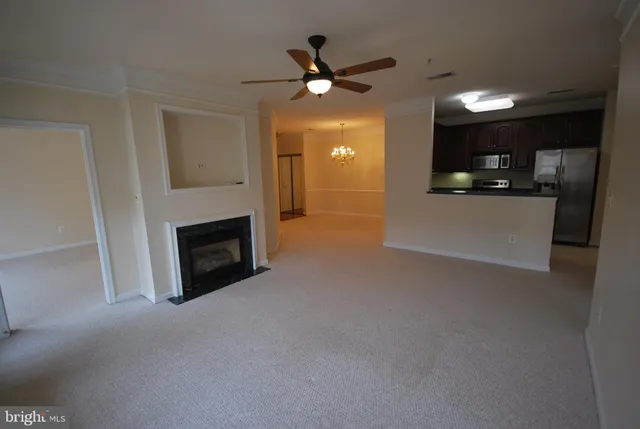 a view of a kitchen with a sink and a fireplace