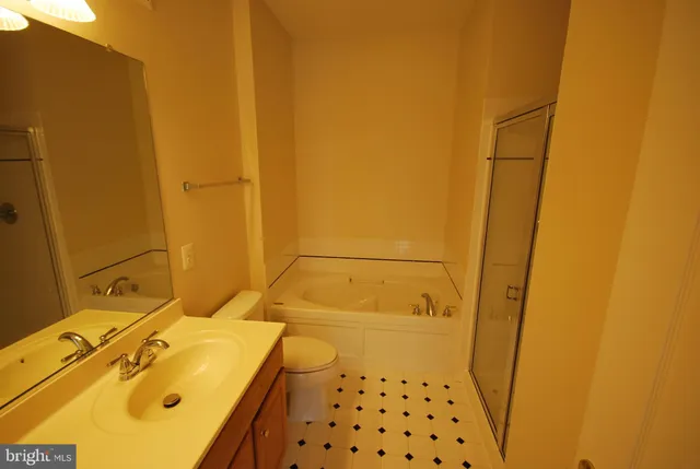 a bathroom with a tub and sink