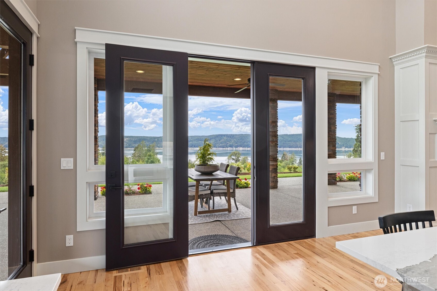 151 East Windy Ridge Lane Belfair, WA 98528 - Photo 12 of 40 a bedroom with a bed and a large window