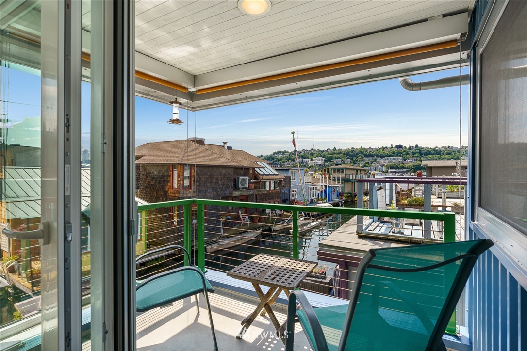 2031 Fairview Avenue East, Unit E Seattle, WA 98102 - Photo 13 of 32 a balcony with furniture and outdoor view