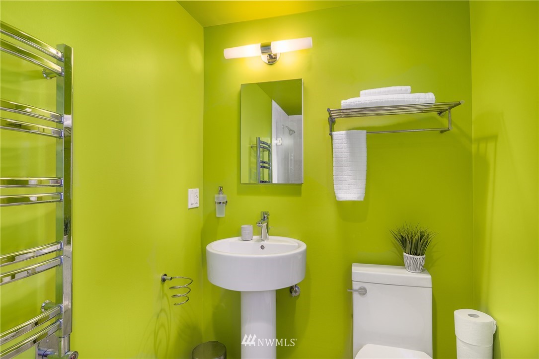 2031 Fairview Avenue East, Unit E Seattle, WA 98102 - Photo 17 of 32 a bathroom with a sink and a mirror